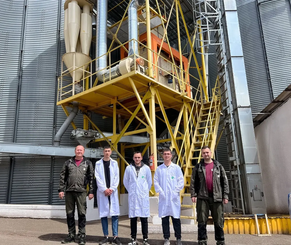 The Crown team in front of the processing line